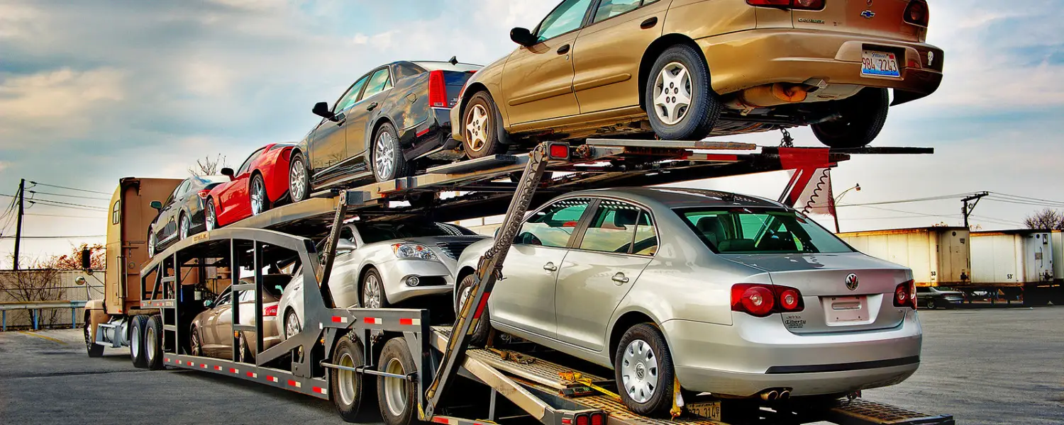 A car carrier truck loaded with multiple cars ready for transport.